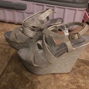 Get all the glitz and glamour with these shiny silver wedges from Cathy Jean!